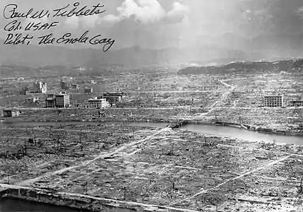 Hiroshima aftermath. Despite a true firestorm developing, reinforced concrete buildings, as in Tokyo, similarly remained standing. Signed by the Enola Gay pilot, Paul W. Tibbets.