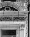 A detail of the ornate terra cotta decoration adorning the building's entrance