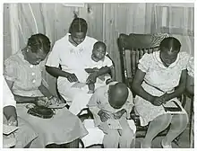 Louisiana home demonstration club meeting has games and refreshments after a discussion, 1940.