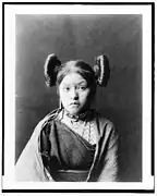 Hopi girl at Walpi, c. 1900, with "squash blossom" hairdo indicative of her eligibility for courtship