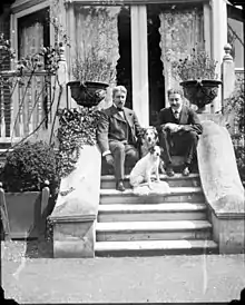 Sturgis and William Haynes Smith with two dogs at Queen's Acres, Windsor, before 1920