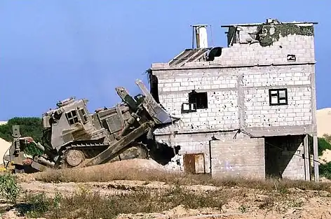 An IDF D9 demolishing a house in the Gaza Strip during the Second Intifada