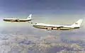 A Boeing 707 of the Imperial Iranian Air Force refuels a Boeing 747 of the IIAF.