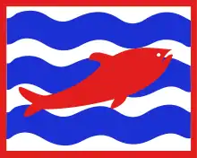 A red fish on alternating blue and white wavy horizontal stripes, within a red border.