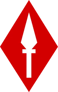 A white spearhead pointing up, on a scarlet diamond.