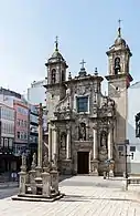 A cruceiro, or wayside cross, and San Xurxo church in A Coruña