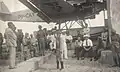 Communist civilians and rebel soldiers stand guard near the captured aircraft.