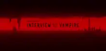 Anne Rice's Interview with the Vampire logo in the red sky between silhouettes of Dubai and New Orleans forming a pair of fangs