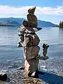 Inuksuk on shore of sw̓iw̓s Provincial Park, looking south over Osoyoos Lake toward Washington state in the distance, July 2020