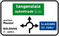 Directions at a roundabout in urban areas. The green panel indicates a motorway