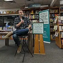 Sexton gives an author talk at Politics and Prose in 2023