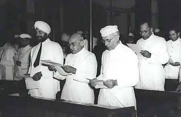 Jawaharlal Nehru and other members taking pledge during the midnight session of the Constituent Assembly of India held on 14 and 15 August 1947.