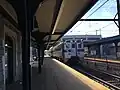 A Warminster-bound train on the Warminster Line stops at Jenkintown–Wyncote station in November 2017