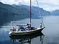 A sailboat explores Princess Royal Reach of the lekw’emin.