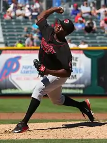 A baseball player in black and gray