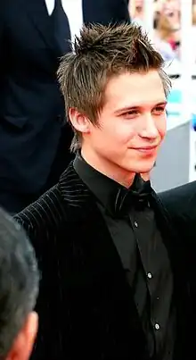 A photo of a young man with short light brown hair.