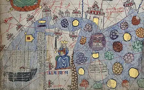 A portion of Catalan atlas depicting Indonesian archipelago. At the left a five-masted inchi (copying error of jũchi, or junk, from Javanese jong). At the center is illa iana (error of illa iaua, the island of Java), which is ruled by a queen (probably Tribhuwana, reigning from 1328 to 1350). To the right are other Indonesian islands.