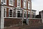 Forecourt wall, piers, railings and gates to Jordangate House