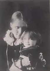 Photo of Julia Stephen with Virginia on her lap in 1884