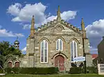 ELONGATED, SYMMETRICAL PLAN BELOW RIDGED AND PARAPET GABLED ROOF. THE ENTRANCE IS SITUATED IN THE GABLE WHICH IS ORNATELY DETAILED WITH BUTRESSES, LARGE POINTED ARCH WINDOWS AND A VENTILATOR. THE TIMBER ENTRANCE DOOR IS ALSO POINTED ARCHED AND HAS A RAI This historic Methodist Church at King William's Town was built in 1855 in the neo-Gothic style. It was later used by the local German Baptist Congregation and is now the home of the South African Missionary Museum.
Type of site: Church, Museum
Current use: Mission Church.