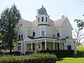 Queen Anne style house with cupola