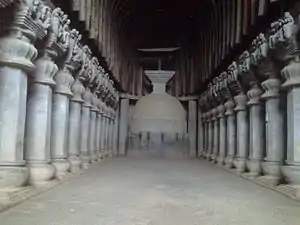 Elaborate prayer hall with pillars in a cave