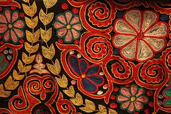 Traditional embroidery in chain stitch on a Kazakh rug, contemporary.