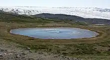 Kettle in Isunngua, a round, shallow glacial lake with no outflow