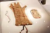 Two of the embroidered gloves found in the antechamber and annexe