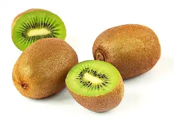 A still life photograph of Kiwifruit against a white background