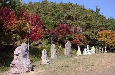 Several stone Buddha sculptures