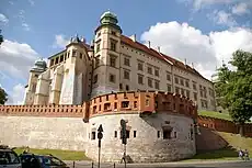 Vytis (Pogonia) on the Sigismund III Vasa Tower (1595) of the Wawel Castle in Kraków, alongside the Polish Eagle and the Double Cross of the Jagiellonians