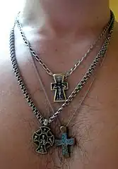 A man with three different cross necklaces