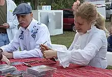 Axelrod and Jim Kweskin autograph CDs at the Kentuck Festival of the Arts (Northport, Alabama, 2015).