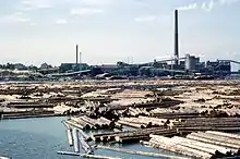 Sawmill with the floating logs in Kotka, Finland.