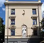 Mural of a painter in classical style in a real 3-dimensional niche in Kaunas, Lithuania