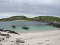 Lagoon on Pabbay Mor with some small boats in it