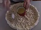 Oil added on top to create crispiness when baked