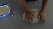 Working the dough by hand