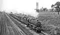 44806 making her way down the goods line with a class C goods train near Langley Mill in July 1963.