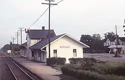 Top: Lee Hall Depot, painted a faded yellow with dark roof