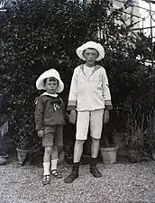 Two boys wearing twin-strap T-bar sandals in Venice, Italy. in 1907.