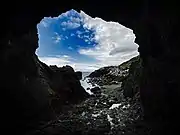 Low tide inside Tobin's Tunnel, a man-made stone tunnel near Mussel Rock.