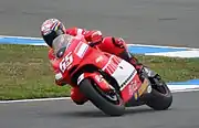 Loris Capirossi riding his Ducati Desmosedici GP5 in 2005 with an alternative red & black "barcode" livery.