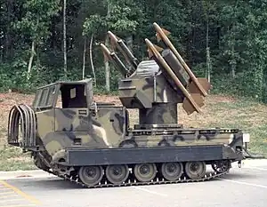 MIM-72 Chaparral with four uncovered missiles and a tractor crawler drive