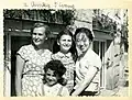 Maria Kuryluk with her children and her Chinese friend I Chang in front of their house on Frascati Street, Warsaw, 1957.