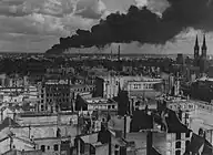 burning Brabag factory in Magdeburg, hit by Allied bombing, January 1945