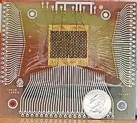 Magnetic-core memory, 18×24 bits, with a US quarter for scale