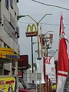 A row of A Mild advertisements (lower right) near Samarinda Central Plaza, Samarinda, East Kalimantan.