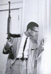 Malcolm X guards his family in an iconic Ebony photo taken by Charles.